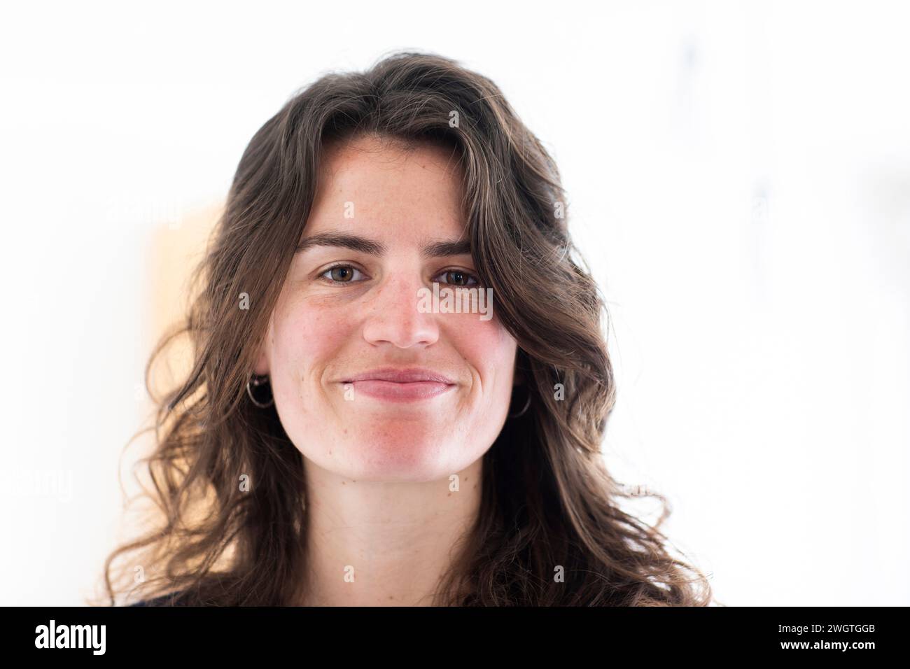 Young woman portrait at home, smiling Stock Photo