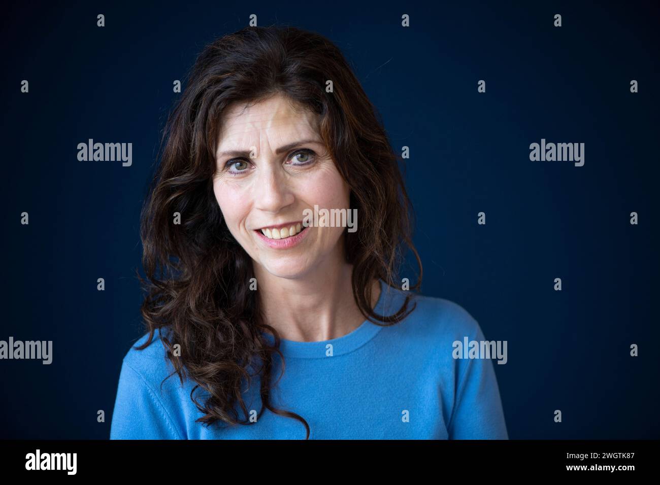 attractive woman looking into camera with an uncomfortable look on her face. Stock Photo