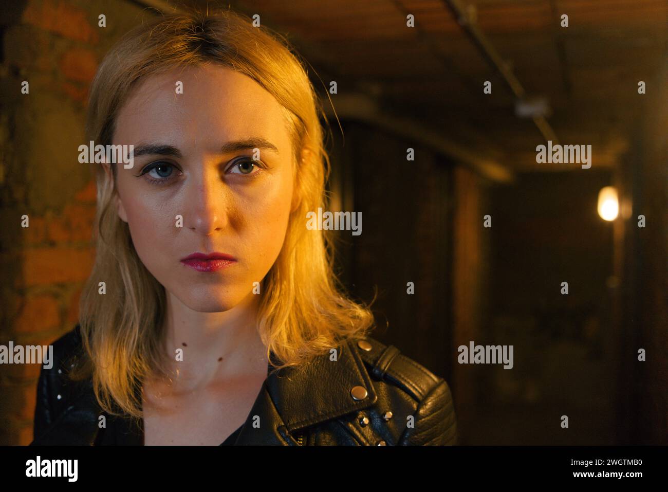 Young blond woman indoors., Milano, Italy. Stock Photo