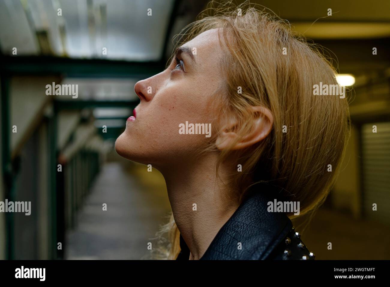 Young blond woman indoors., Milano, Italy. Stock Photo