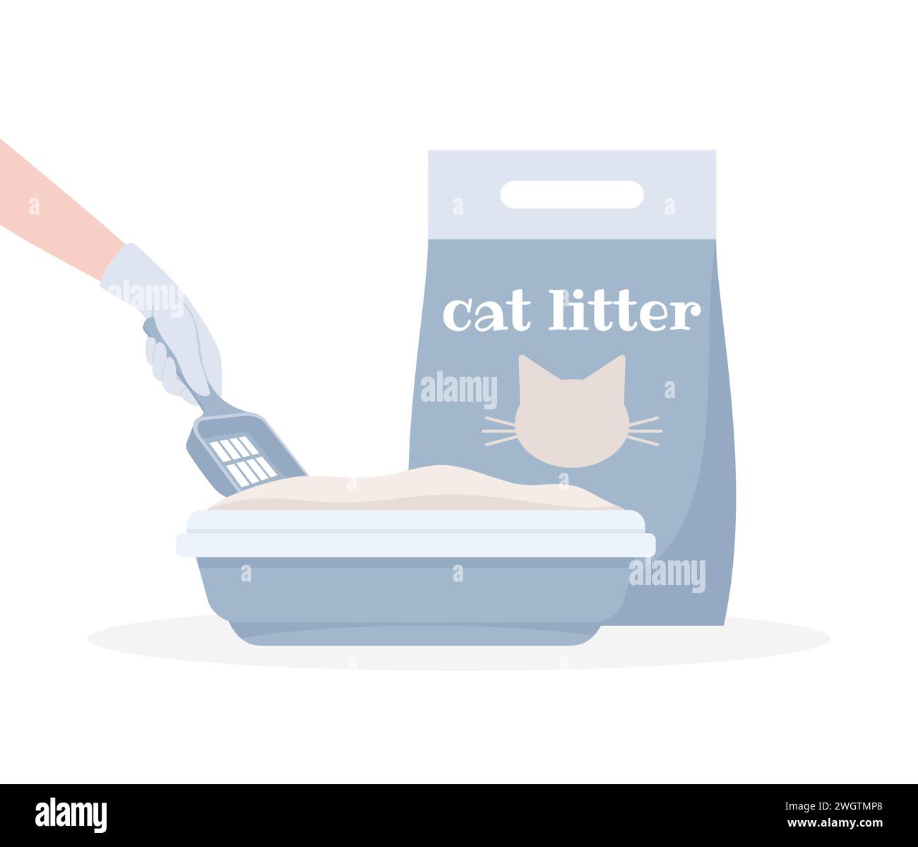 A pack of cat litter filler and a gloved hand with a shovel cleaning a