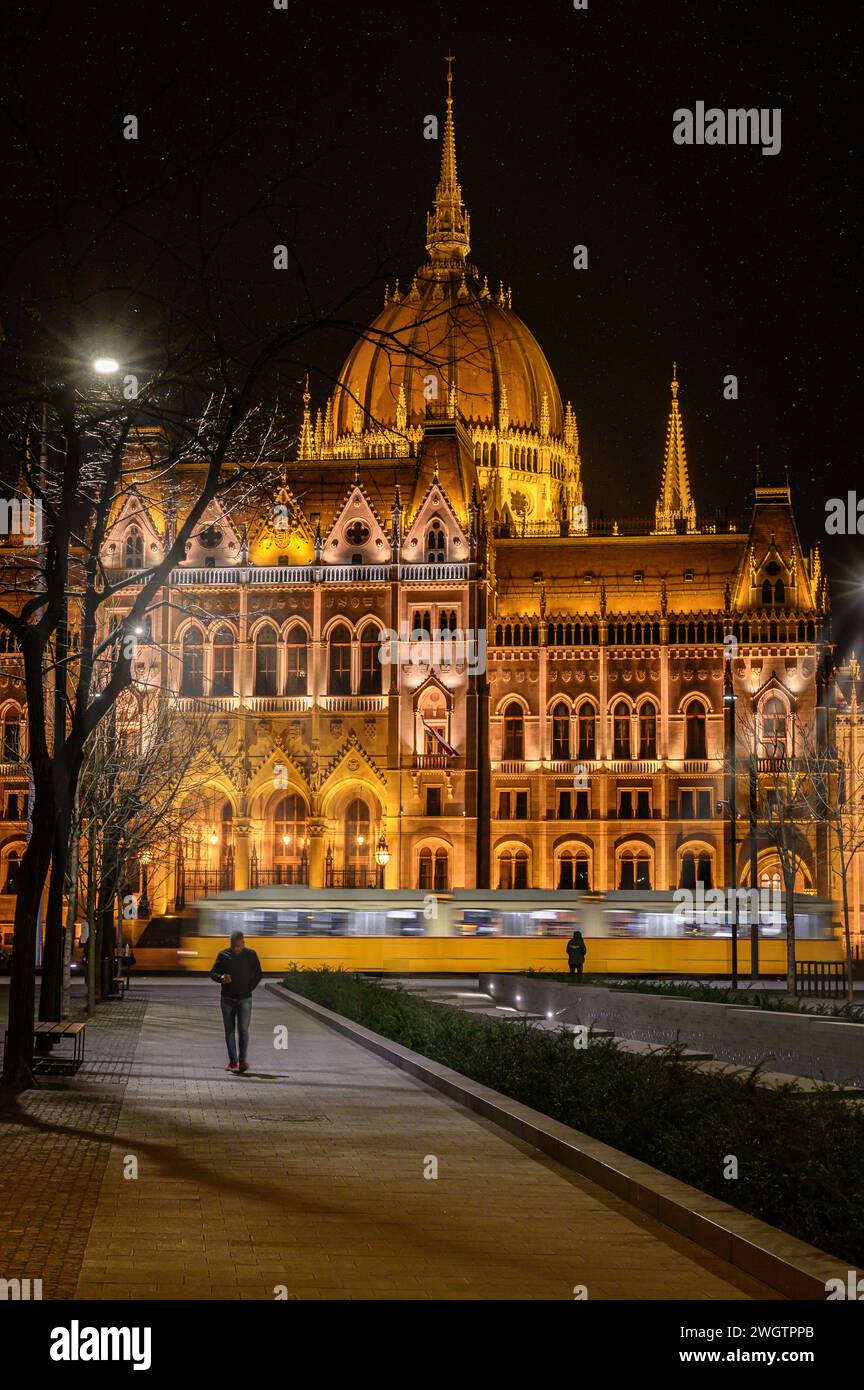 Tram passes in front of the Hungarian Parliament Building Stock Photo