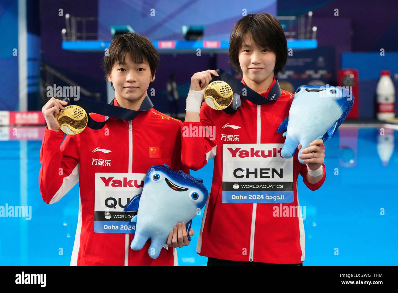 Chen Yuxi and Quan Hongchan of China pose with their medals after