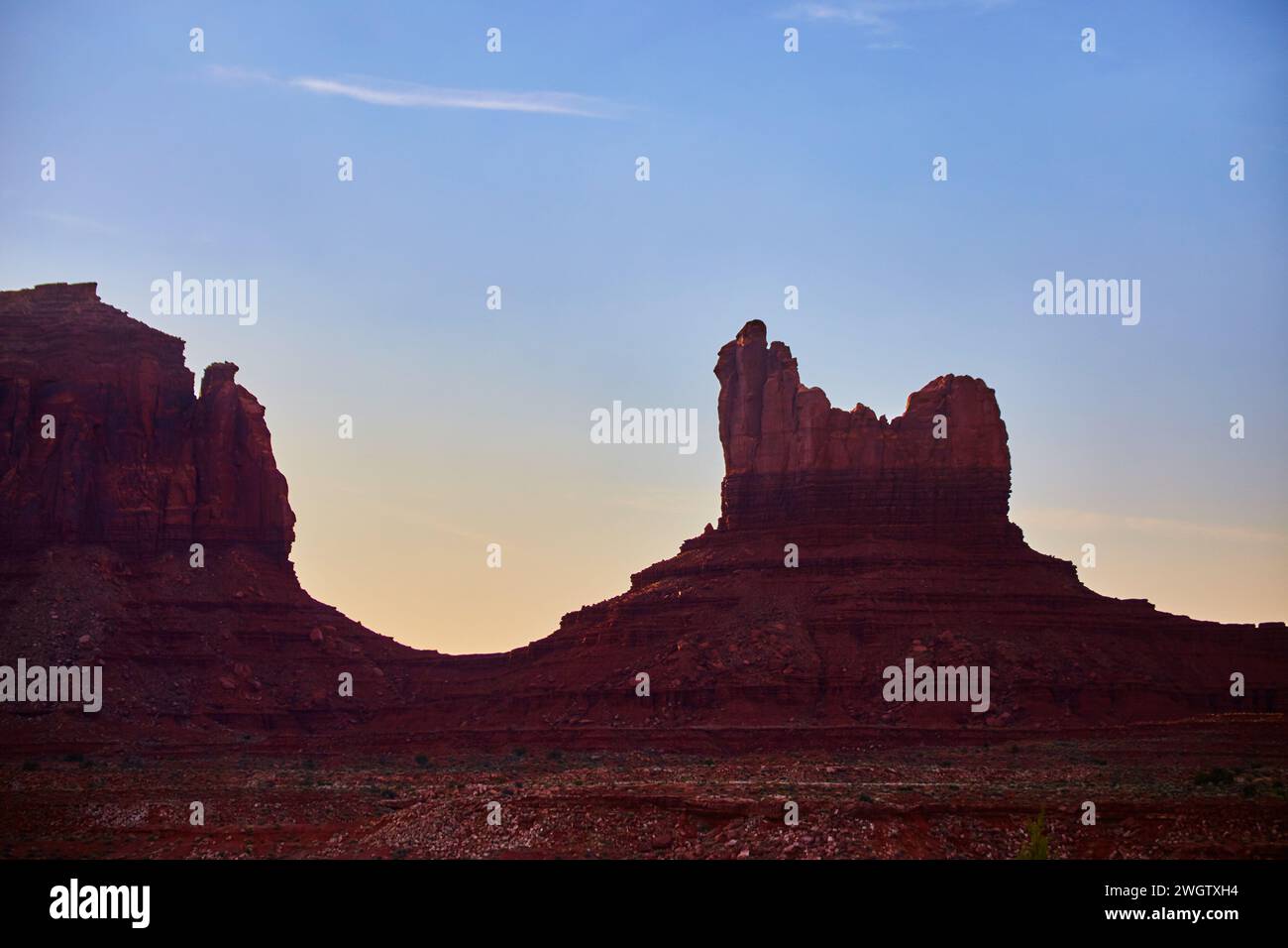 Twilight Red Rock Butte in Southwestern Desert, Ground View Stock Photo