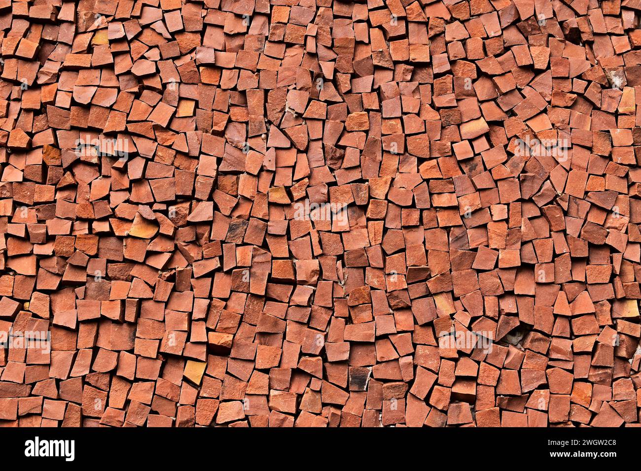 Red mosaic stones on wall Stock Photo