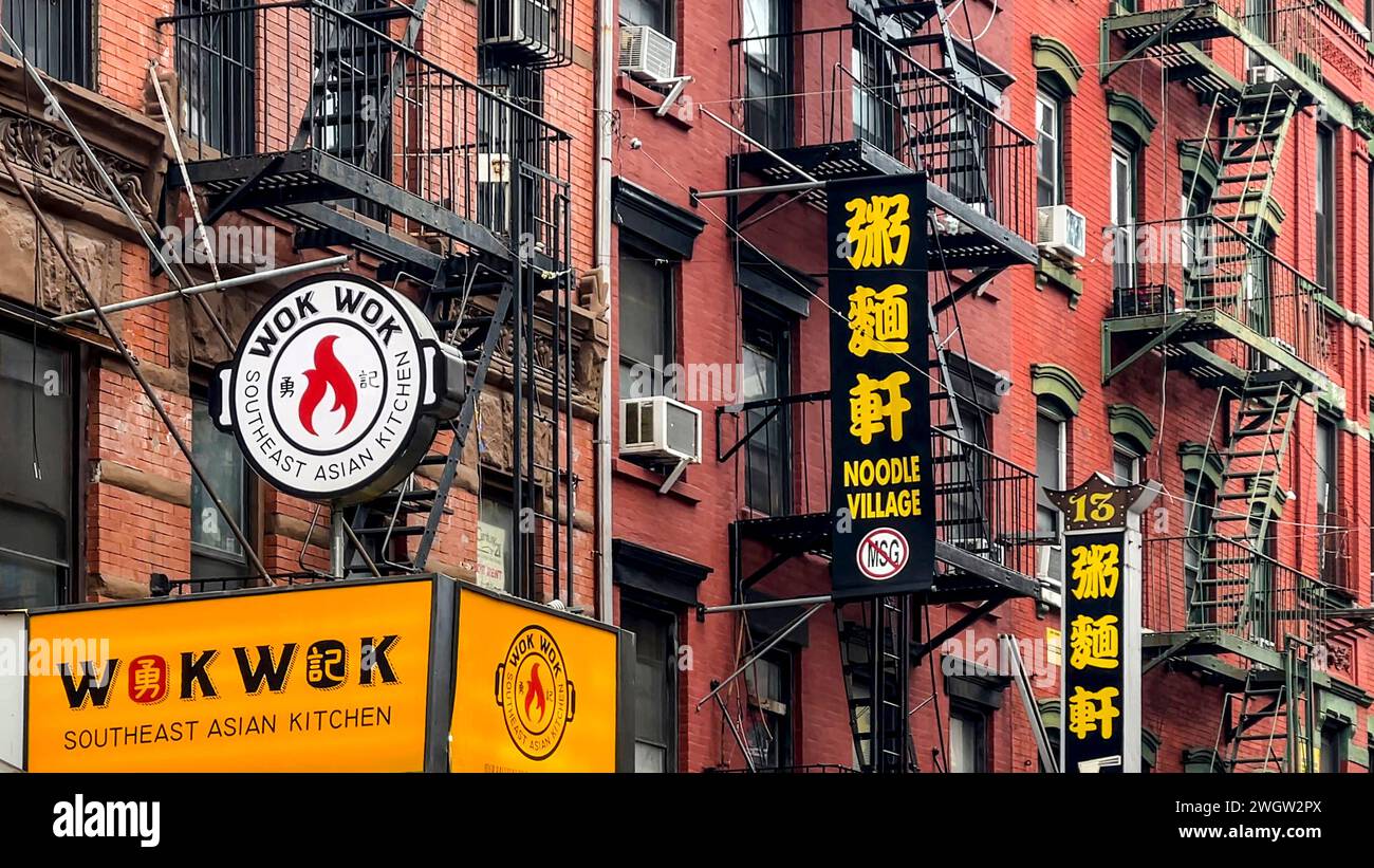 New York, USA; January 4, 2024: TThe famous Chinatown neighborhood with sidewalks lined with souvenir stores, bubble tea and markets selling everythin Stock Photo