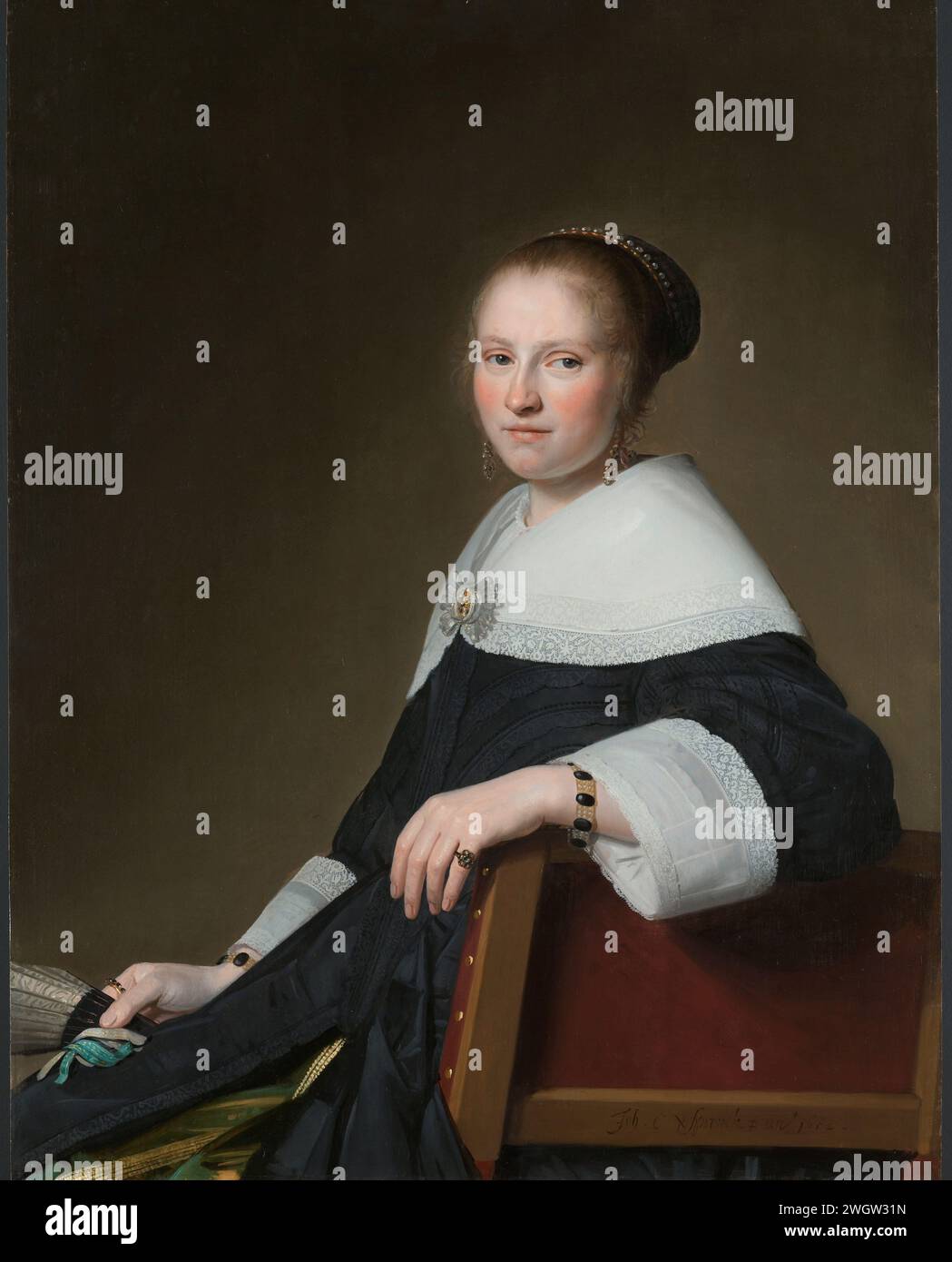 Portrait of Maria van Strijp, Johannes Cornelisz. Verspronck, 1652 painting Portrait of Maria van Strijp (1627-1707), wife of Eduard Wallis. Pendant of SK-A-4999. Knee piece, sitting in a seat to the left, the face turned to the viewer. A fan in the right hand.  panel. oil paint (paint) painting historical persons - BB - woman Stock Photo