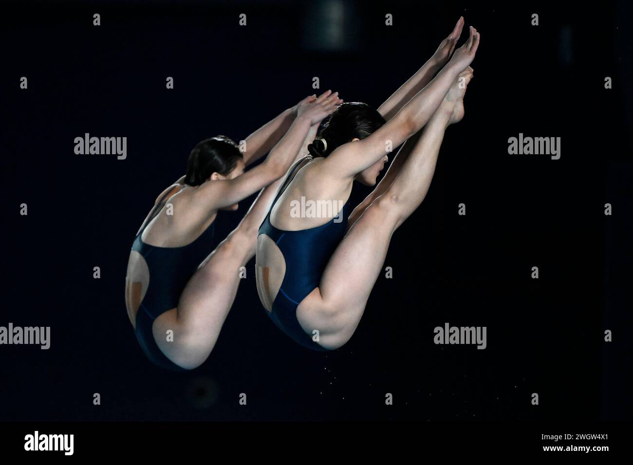 Mi Rae Kim and Jin Mi Jo of North Korea compete in the women's 10m