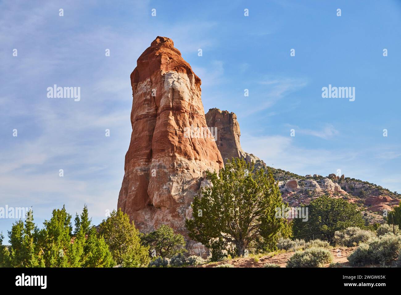 Sedona Red Rock Formation, Blue Sky and Desert Vegetation Stock Photo