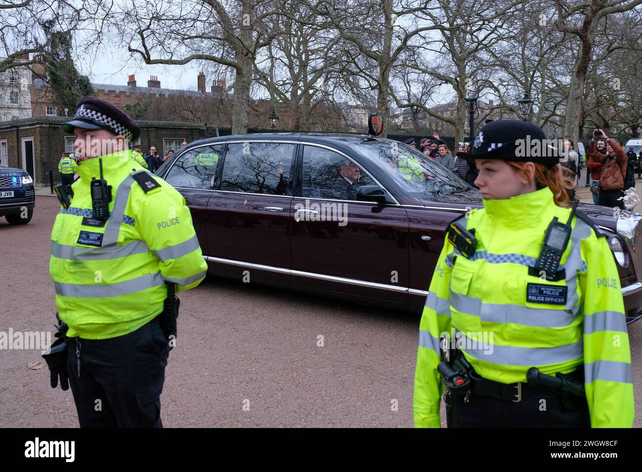 London, UK, 6th February, 2024. King Charles departs Clarence House accompanied by the Queen where he was driven a short distance to Buckingham Palace and shortly left in a helicopter. This follows his cancer diagnosis, announced via a Palace statement yesterday. Credit: Eleventh Hour Photography/Alamy Live News Stock Photo