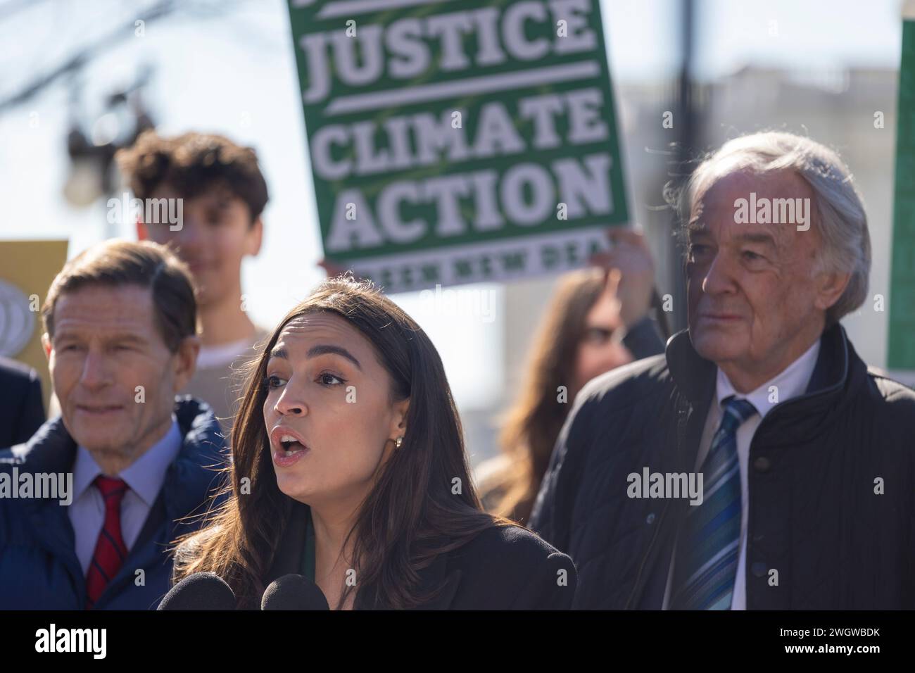 Washington, District Of Columbia, USA. 6th Feb, 2024. Congresswoman Alexandria Ocasio-Cortez (D-NY), at podium, and Senator Edward J. Markey (D-MA.) were joined by labor, health, and climate justice advocates in celebrating the reintroduction of the Green New Deal Resolution Tuesday, Feb. 6, 2024 in Washington. The Green New Deal proposes to tackle the climate crisis with a 10-year mobilization that puts millions of Americans to work in good-paying, union jobs. Similar to FDRÃs New Deal, these jobs would be focused on strengthening the nationÃs public infrastructure as well as tackling po Stock Photo