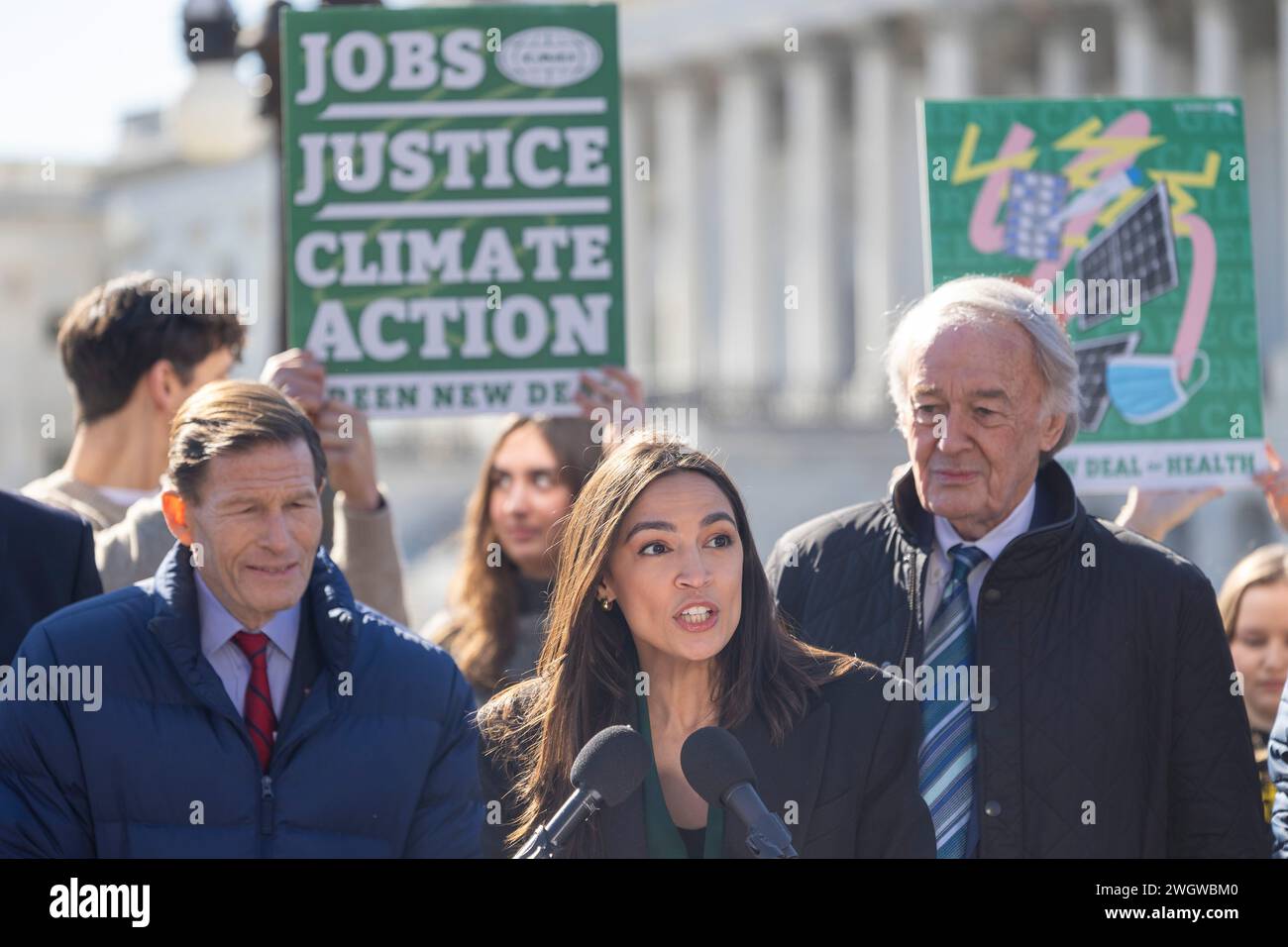 Washington, District Of Columbia, USA. 6th Feb, 2024. Congresswoman Alexandria Ocasio-Cortez (D-NY), center, and Senator Edward J. Markey (D-MA.) were joined by labor, health, and climate justice advocates in celebrating the reintroduction of the Green New Deal Resolution Tuesday, Feb. 6, 2024 in Washington. The Green New Deal proposes to tackle the climate crisis with a 10-year mobilization that puts millions of Americans to work in good-paying, union jobs. Similar to FDRÃs New Deal, these jobs would be focused on strengthening the nationÃs public infrastructure as well as tackling pollu Stock Photo