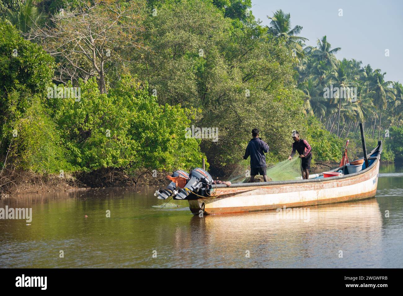 Agonda, Goa, India, Fisherman in the boat at a lagoon of Agonda beach, Editorial only. Stock Photo