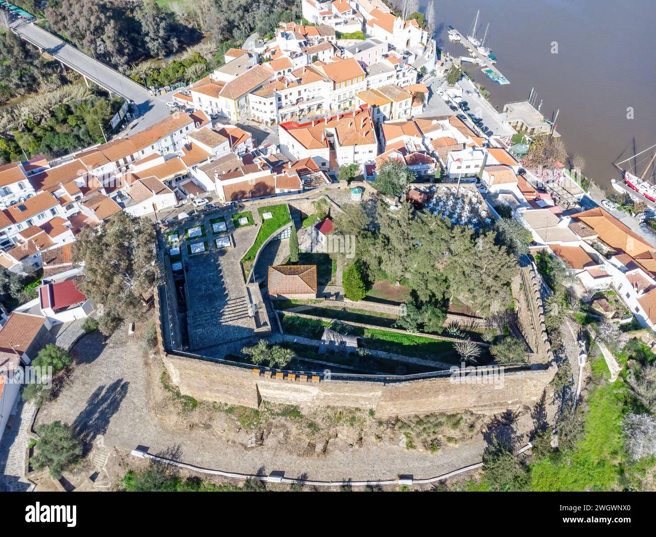 Aerial drone view of Alcoutim Castle (Castelo de Alcoutim) in the border town of Alcoutim, Algarve, on the banks of Guadiana river, in the border of P Stock Photo