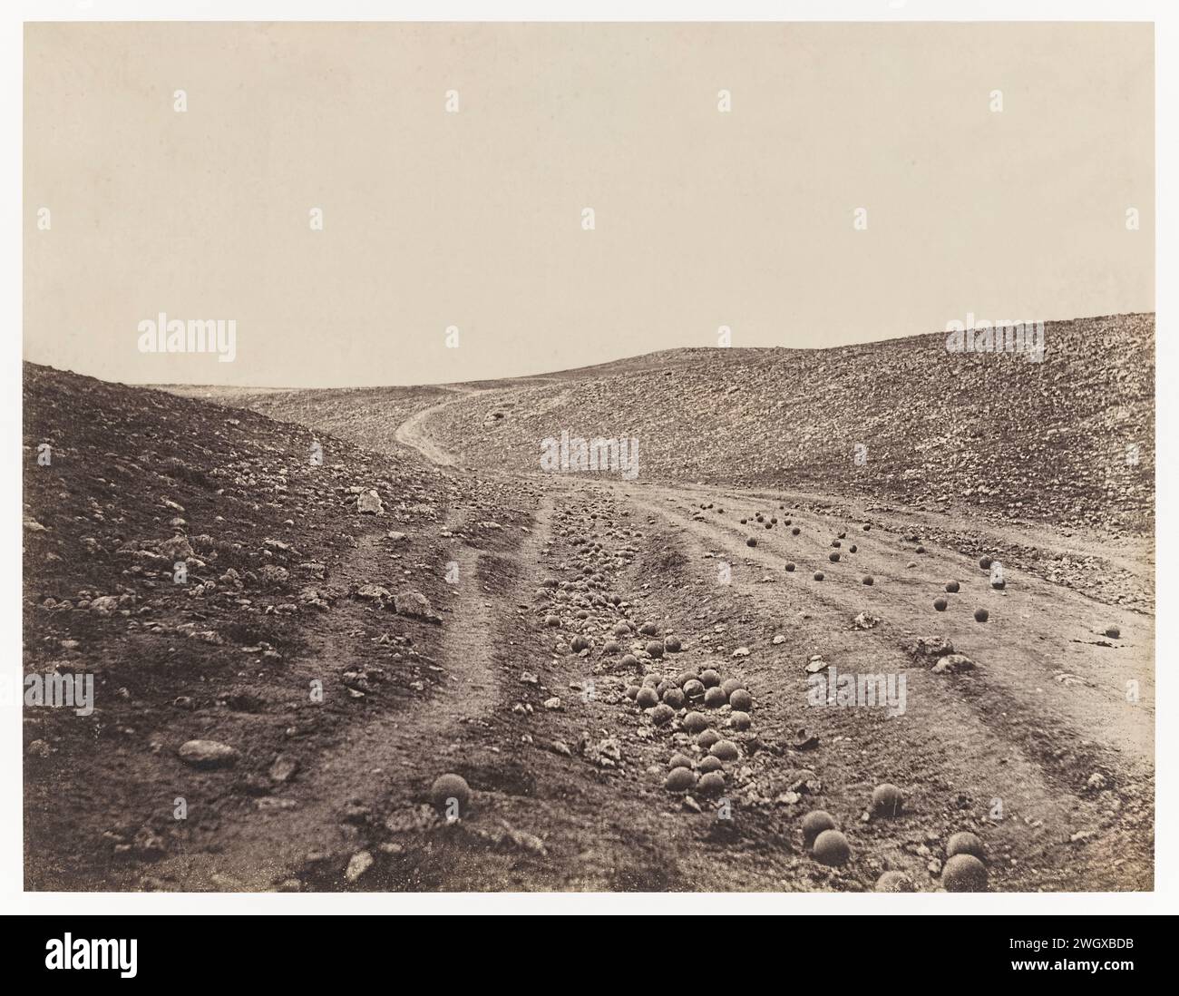 Valley of the Shadow of Death’ photograph taken during the Crimean War by Roger Fenton (1819-1869) on 23 April 1855. This now iconic image shows a heavily bombarded road in a ravine strewn with cannonballs fired by the Russian Empire at British soldiers. Stock Photo