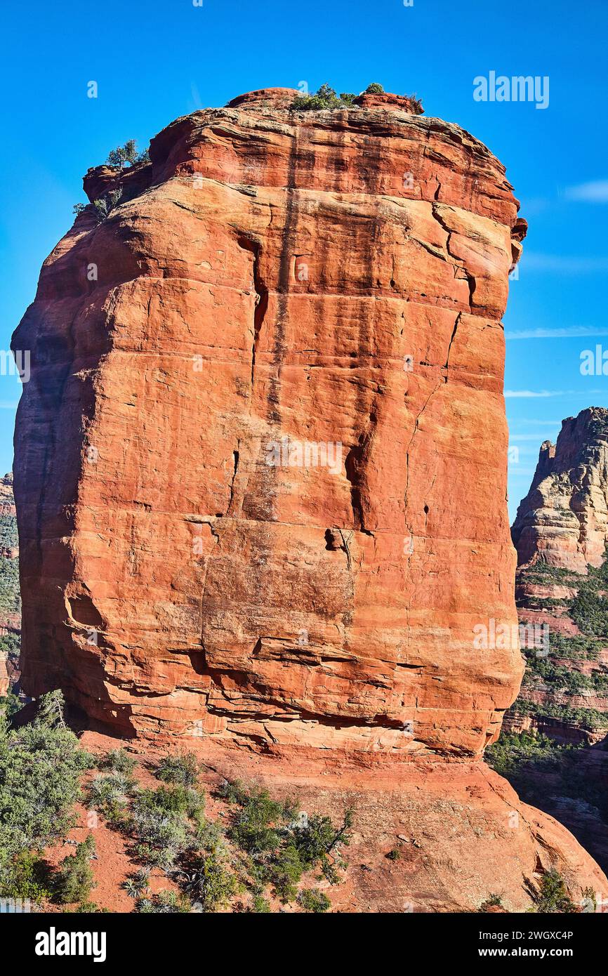 Aerial View of Majestic Sedona Red Rock Formation Under Blue Sky Stock Photo