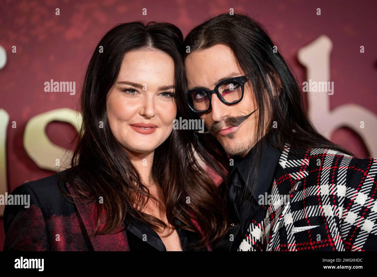 Lottie Archer-Kane and Joshua Kane, right pose for photographers upon arrival for a special VIP remastered screening of Les Miserables, at a central London cinema, Tuesday, Feb. 6, 2024. (Photo by Scott A Garfitt/Invision/AP) Stock Photo