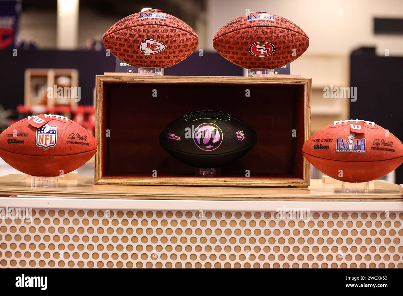 Las Vegas, NV, USA. 06th Feb, 2024. A sneak preview of the Usher/Wilson NFL football (center), that will only be available online, on display inside the Super Bowl Experience taking place from Wednesday, February 7 - Saturday, February 10 at the Mandalay Bay Convention Center in Las Vegas, NV. Christopher Trim/CSM/Alamy Live News Stock Photo