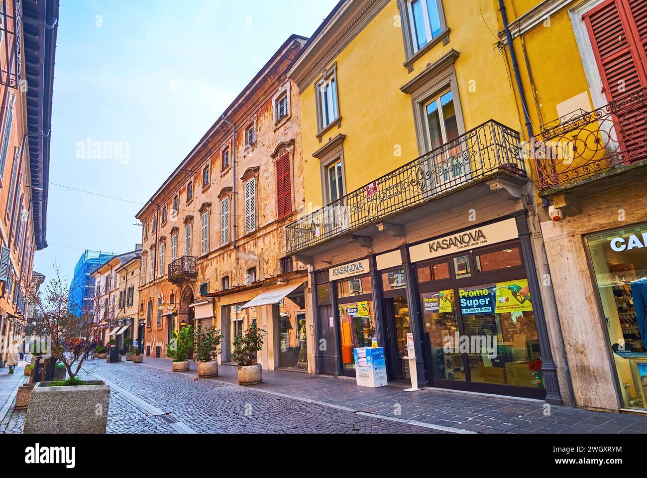 LODI, ITALY - APRIL 6, 2022: The line of stores and brand boutiques on Corso Roma in old town, Lodi, Lombardy, Italy Stock Photo