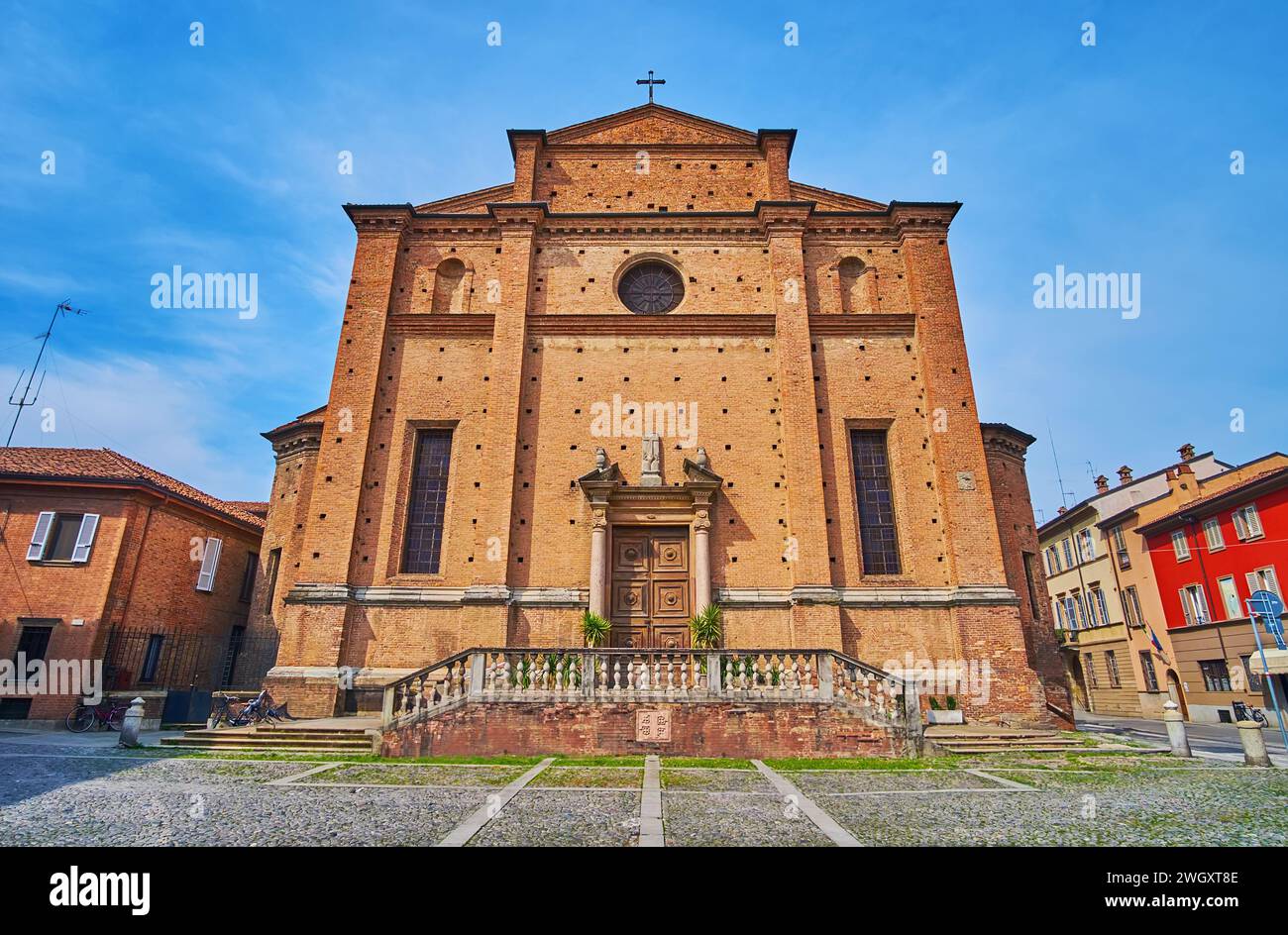 The facade of the medieval Santo Sepolcro Church (Holy Sepulchre), located on Cantone San Nazzaro str, Piacenza, Italy Stock Photo