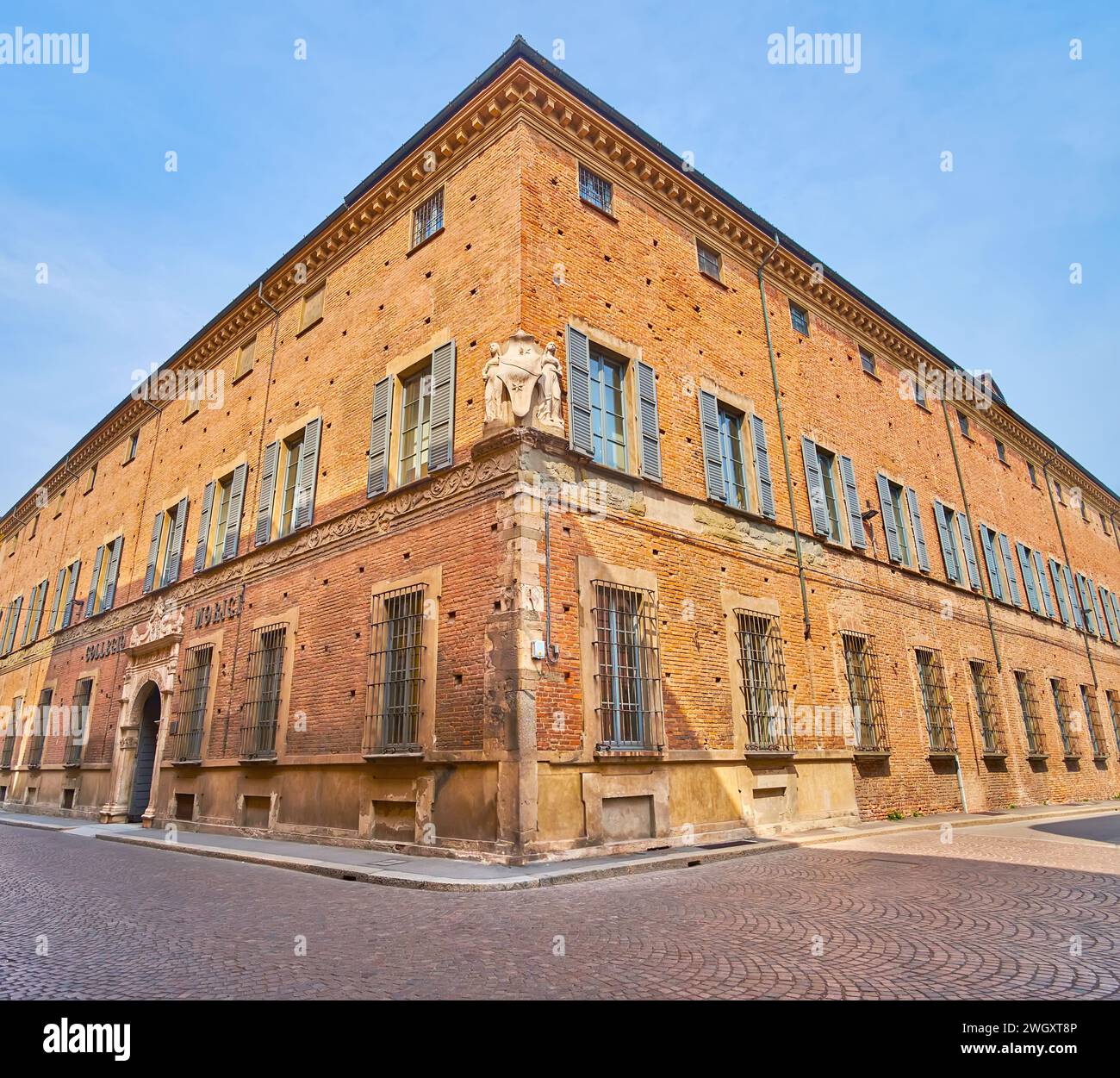 The corner of the medieval brick Palazzo Scotti di Castelbosco Marazzani, Piacenza, Italy Stock Photo