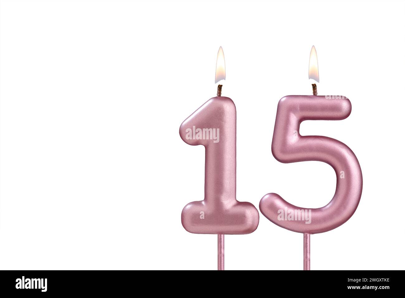 Candle number 15 Lit birthday candle on white background Stock Photo Alamy