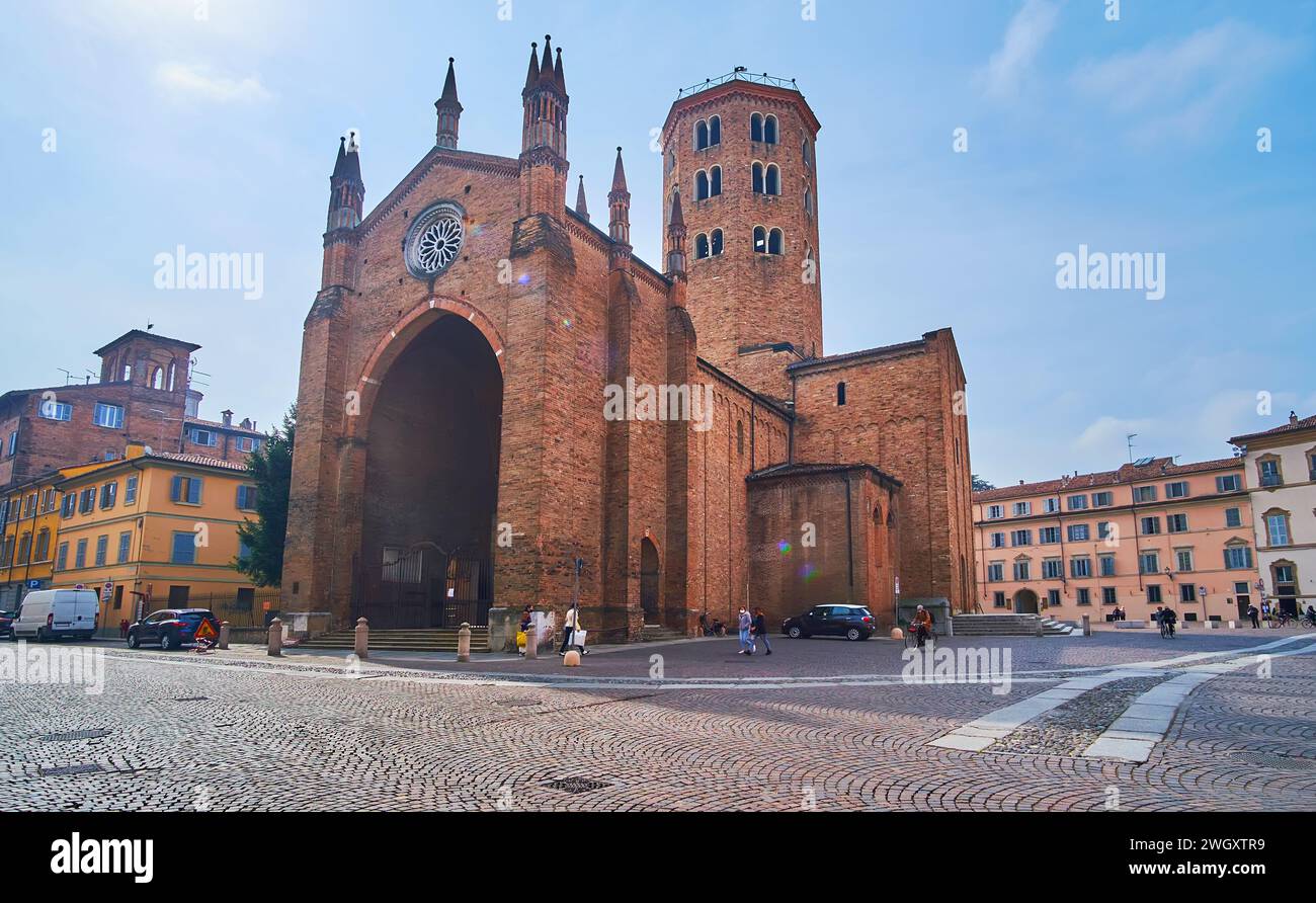 Panorama of the medieval St Antoninus Square with brick Church, decorated with Paradise Portico, campanile and small towers, Piacenza, Italy Stock Photo