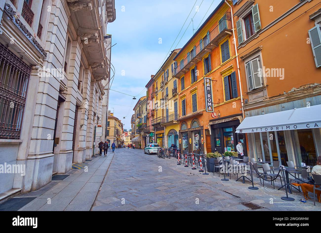 Historic Corso Giuseppe Mazzini Street with restaurants, cafes, bars and shops in medieval buildings, Cremona, Italy Stock Photo