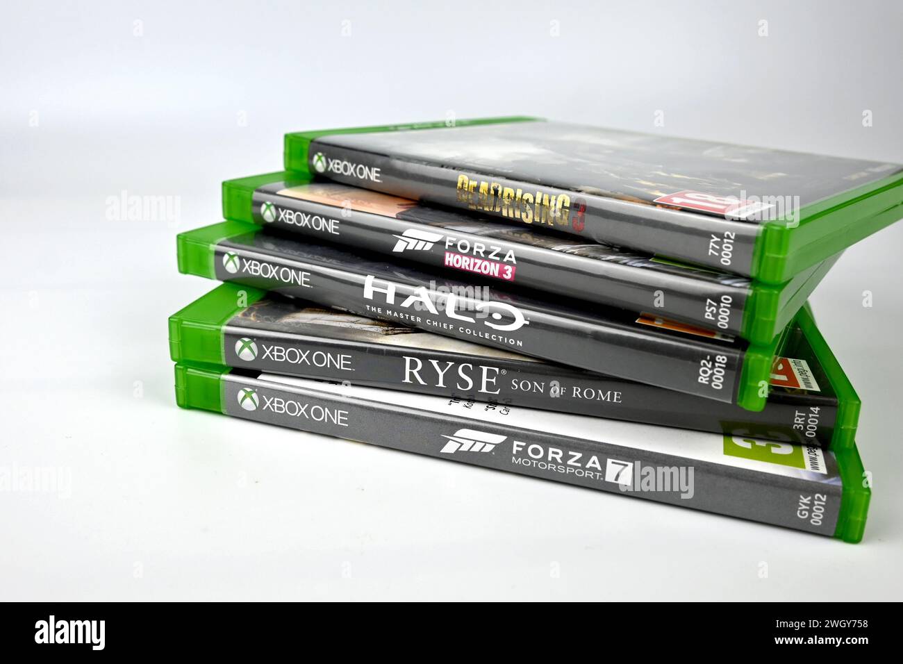 Xbox One exclusive game titles stacked pile  (Forza, Halo, Dead Rising 3 and Ryse: Son of Rome)– Wales, UK  –  6 February 2024 Stock Photo