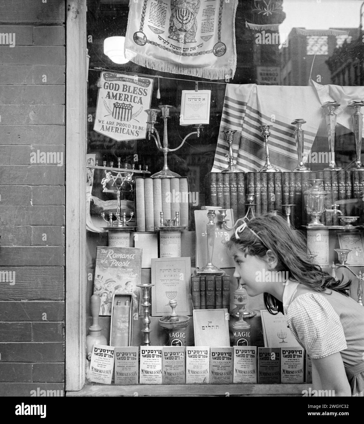 Young girl looking in window of Jewish shop, Broome Street, New York City, New York, USA, Marjory Collins, U.S. Office of War Information, Stock Photo