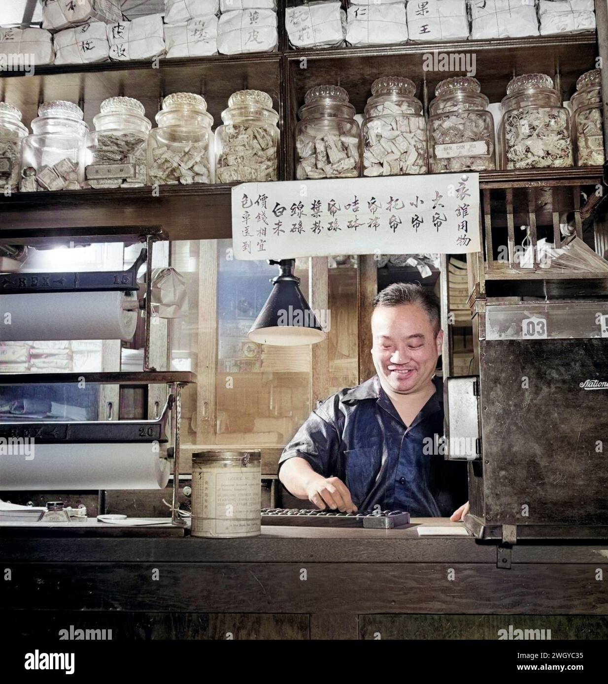 Chinese man counting on abacus in grocery store, Chinatown, New York City, New York, USA, Marjory Collins, U.S. Office of War Information, August 1942 Stock Photo