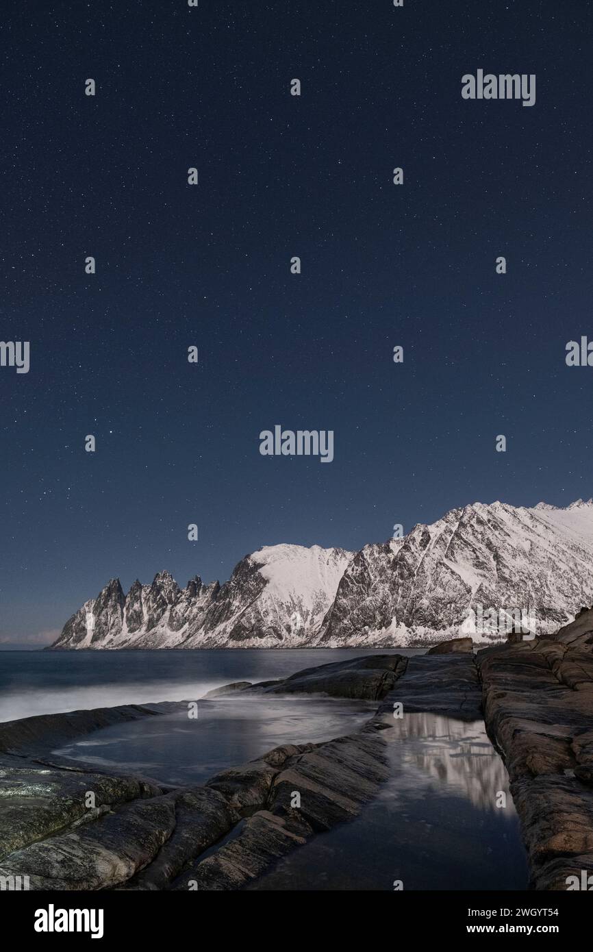 Night Sky over The Devils Jaw and Ersfjord, Tungeneset, Senja, Troms og Finnmark County, Norway, Scandinavia, Europe Stock Photo