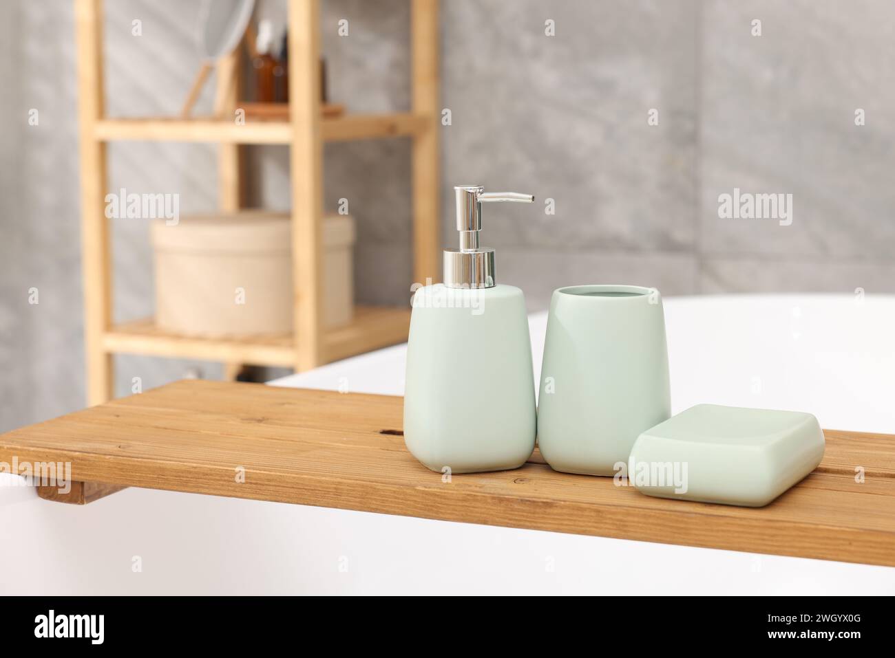 Set of bath accessories on tub in bathroom Stock Photo - Alamy