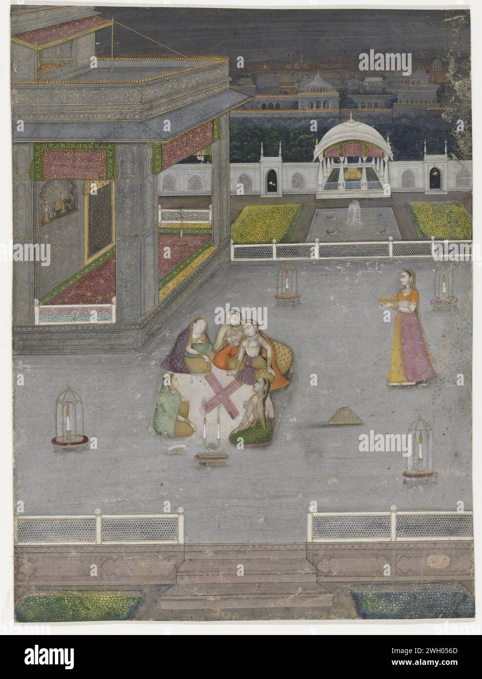 Evening in the women's rooms, anonymous, c. 1760 - c. 1770 Indian miniature Four women play a board game in a spacious courtyard of a palace. The woman at the front right has three elongated dice in hand, ready to throw. The woman to her right is leaning against a roll cushion. She is the most important lady. The game that is played here is called Chaupar of Pacisi. It is night, but there are lamps everywhere to illuminate the terrace. In the background, an immense amount of lights are placed on the walls of the city. The Islamic festival Shab-i-barat is probably celebrated here. Lucknow (poss Stock Photo