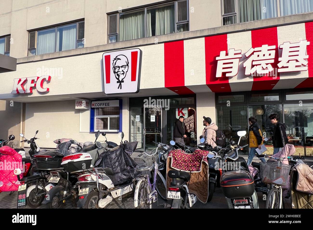 Beijing, China. 08th Dec, 2023. Customers enter a KFC and Taco Bell