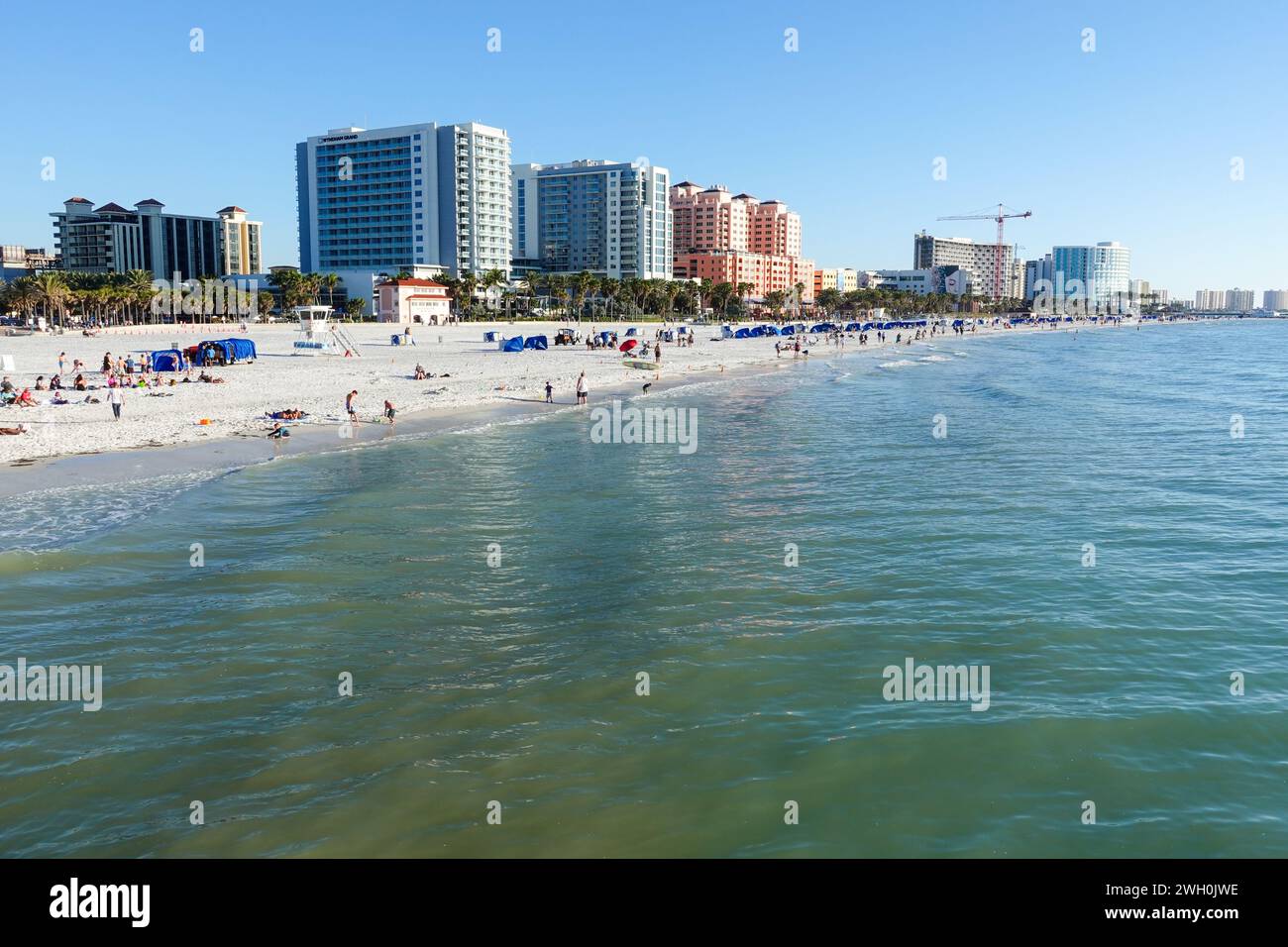 Sunny day at Clearwater Beach, Florida, with resort apartments overlooking the white sandy beach Stock Photo