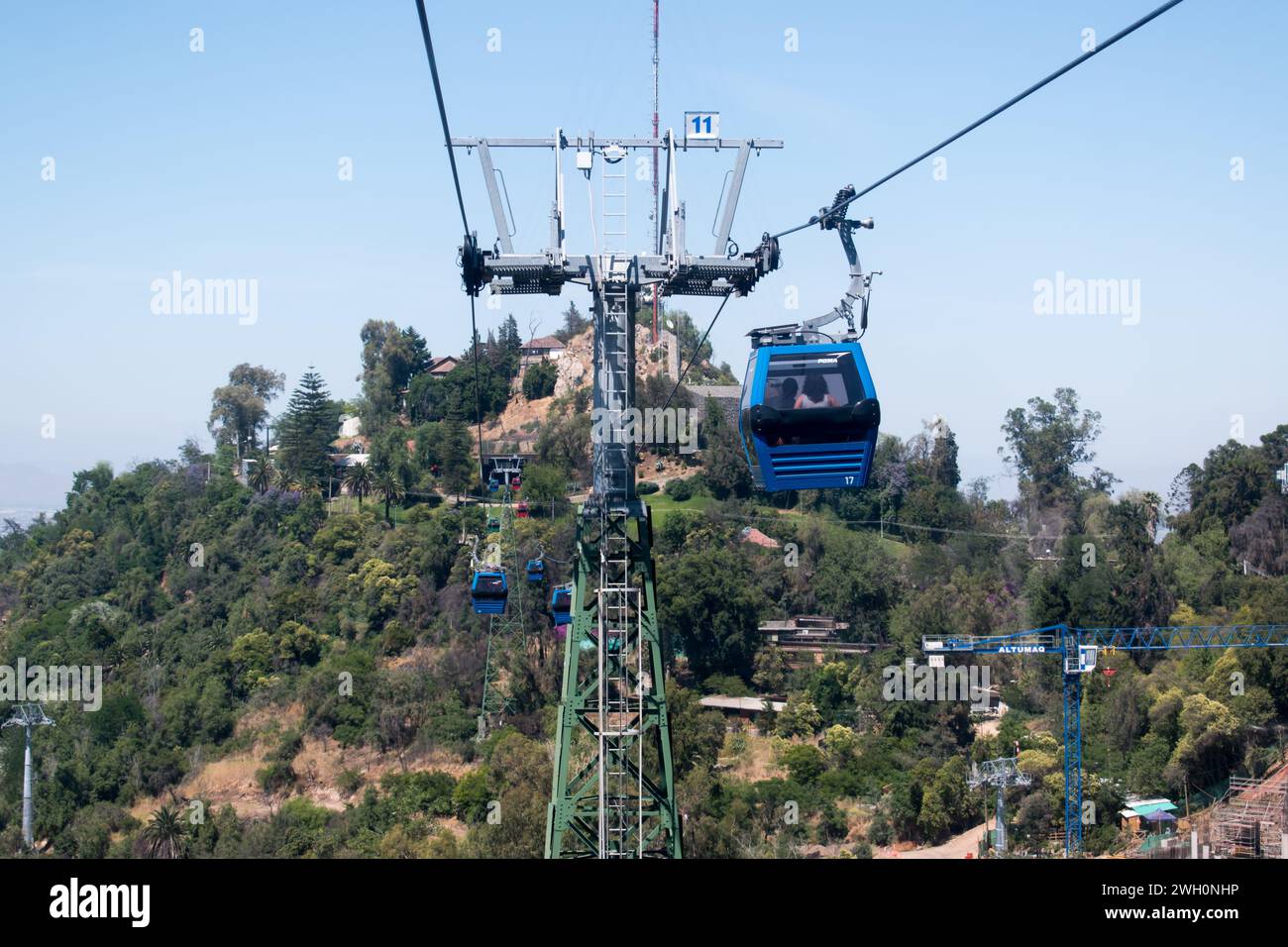 The Santiago cable car, or Teleférico is a popular tourist attraction providing convenient access to Cerro San Cristóbal hill's summit. Stock Photo