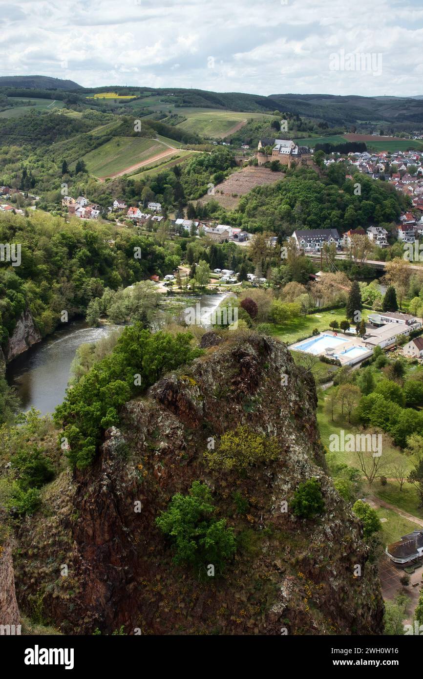 Bad Munster, Germany - May 12, 2021: Top of Rotenfels overlooking Rheingrafenstein Castle on a hill above Bad Munster and the Nahe River on a spring d Stock Photo