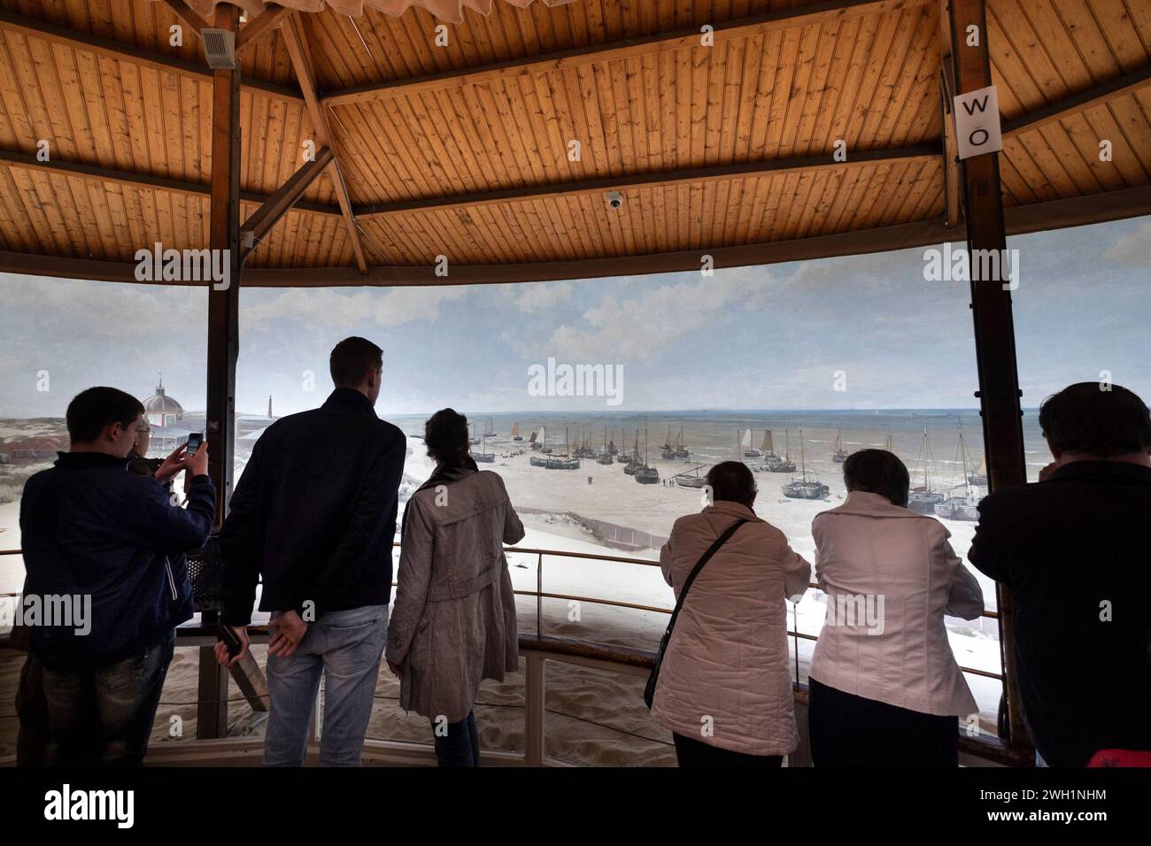 Visitors admire the famous giant cylindrical painting of Scheveningen of the Dutch painter Mesdag from an observation gallery in the Museum Mesdag Stock Photo