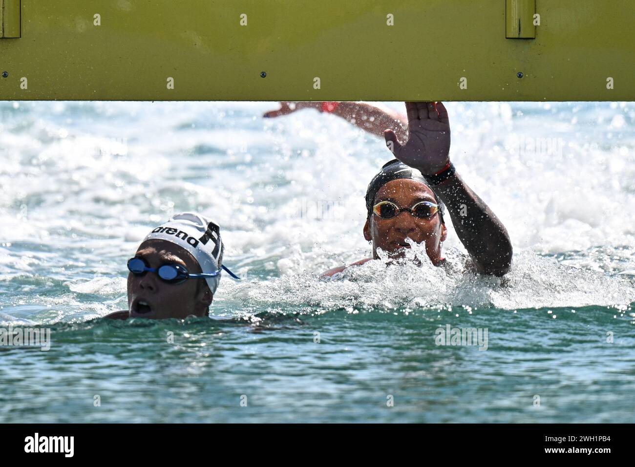 Doha, Qatar. 7th Feb, 2024. Ana Marcela Cunha (R) of Brazil competes during the women's 5km final of open water at the World Aquatics Championships 2024 in Doha, Qatar, Feb. 7, 2024. Credit: Xue Yuge/Xinhua/Alamy Live News Stock Photo