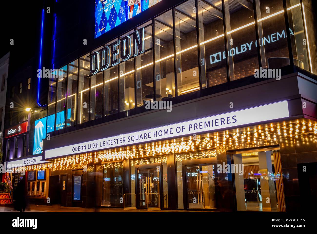 London. UK- 02.04.2024. Exterior night time view of the facade and entrance of the Odeon cinema in Leicester Square. Stock Photo