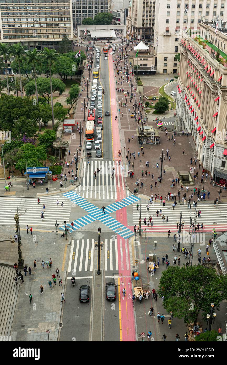 aerial view of busy streets intersection in the city center with buses