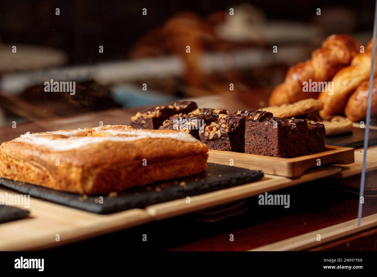 A delicious assortment of baked goods showcased in a display case, bar