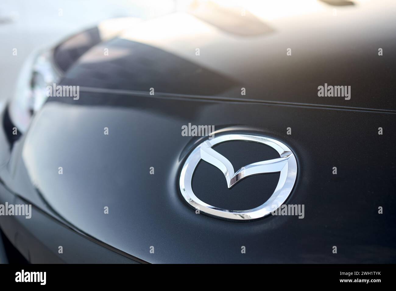 Berlin, Germany - August 20, 2022: Car Detail Shot of Mazda RX-8. Mazda badge logo emblem selective focus closeup with copyspace. Stock Photo