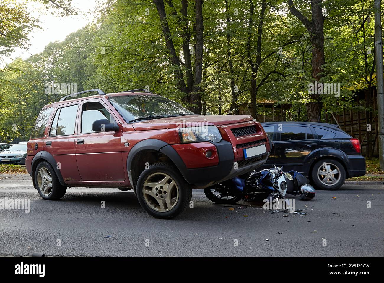 September 13, 2023, Riga, Latvia, damaged car and motorbike on the city ...