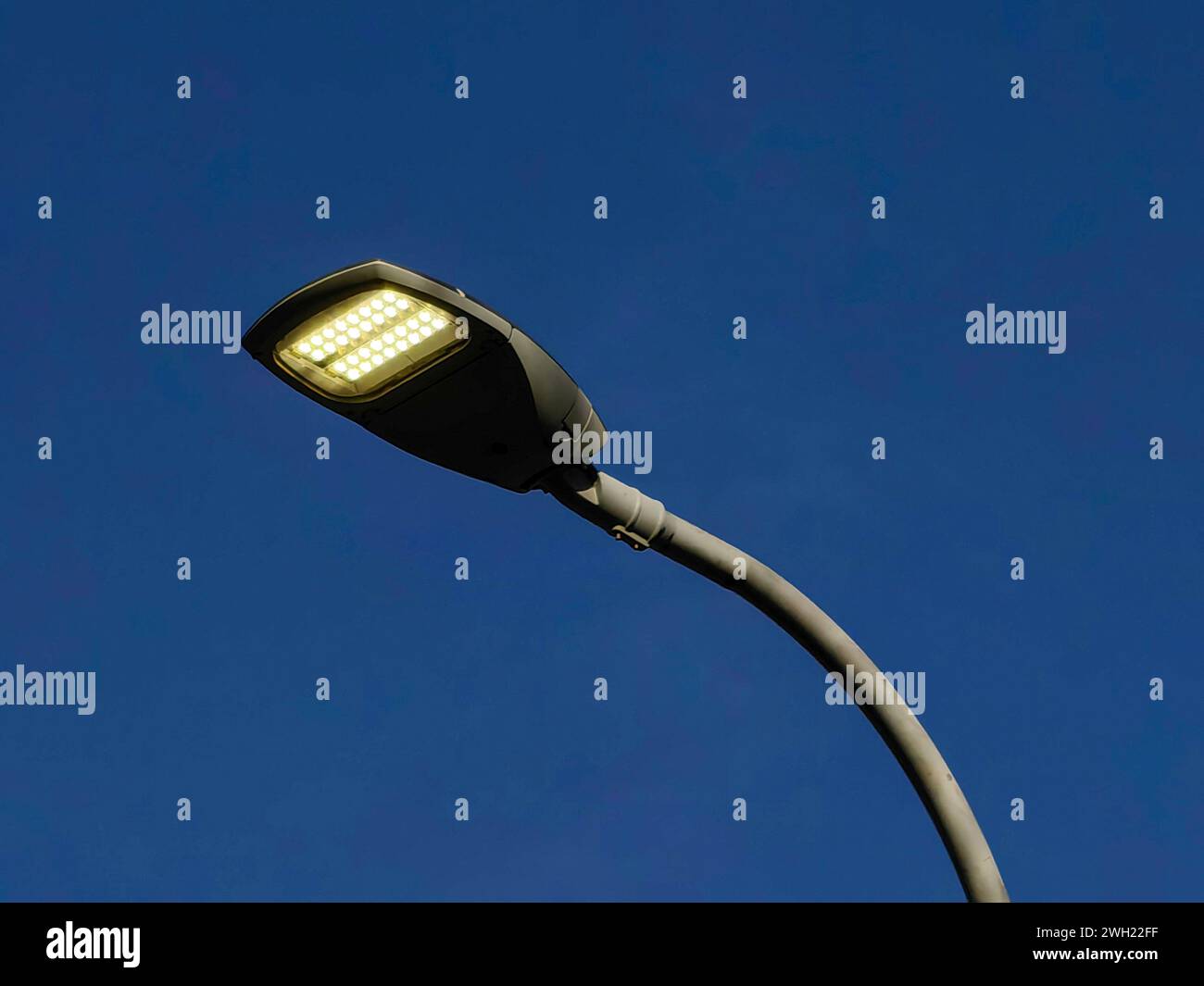 Artificial neon light, during day. Against blue sky background Stock
