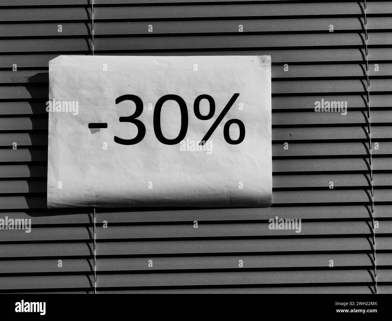 30  % sale discount. Shopping time. Sunlit s blinds cover. Protection. Store expose. Sales event. Stock Photo
