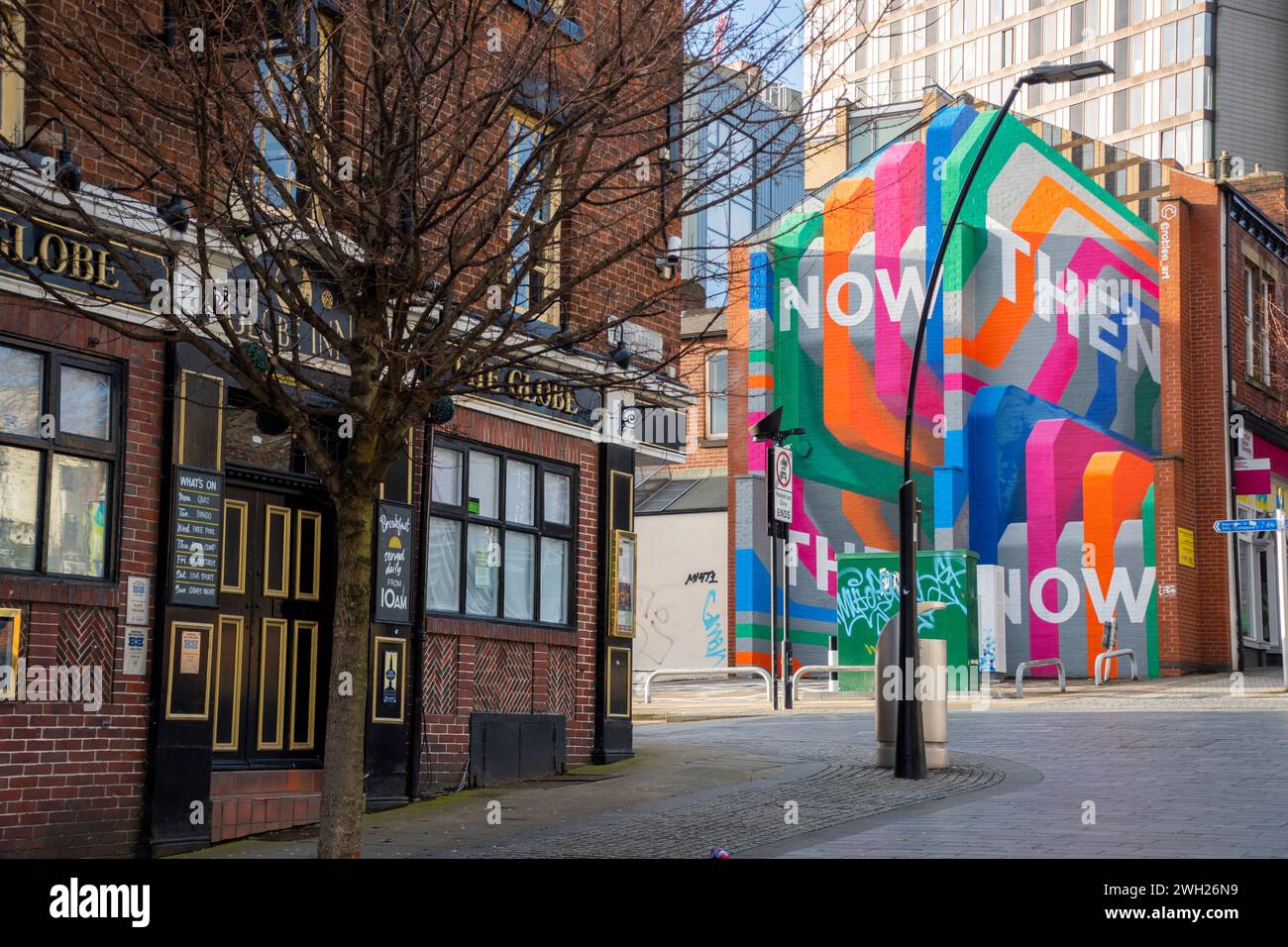 Yorkshire, UK – 27 Dec 2020: Brightly coloured Now Then offices and The Globe public house, Sheffield Stock Photo