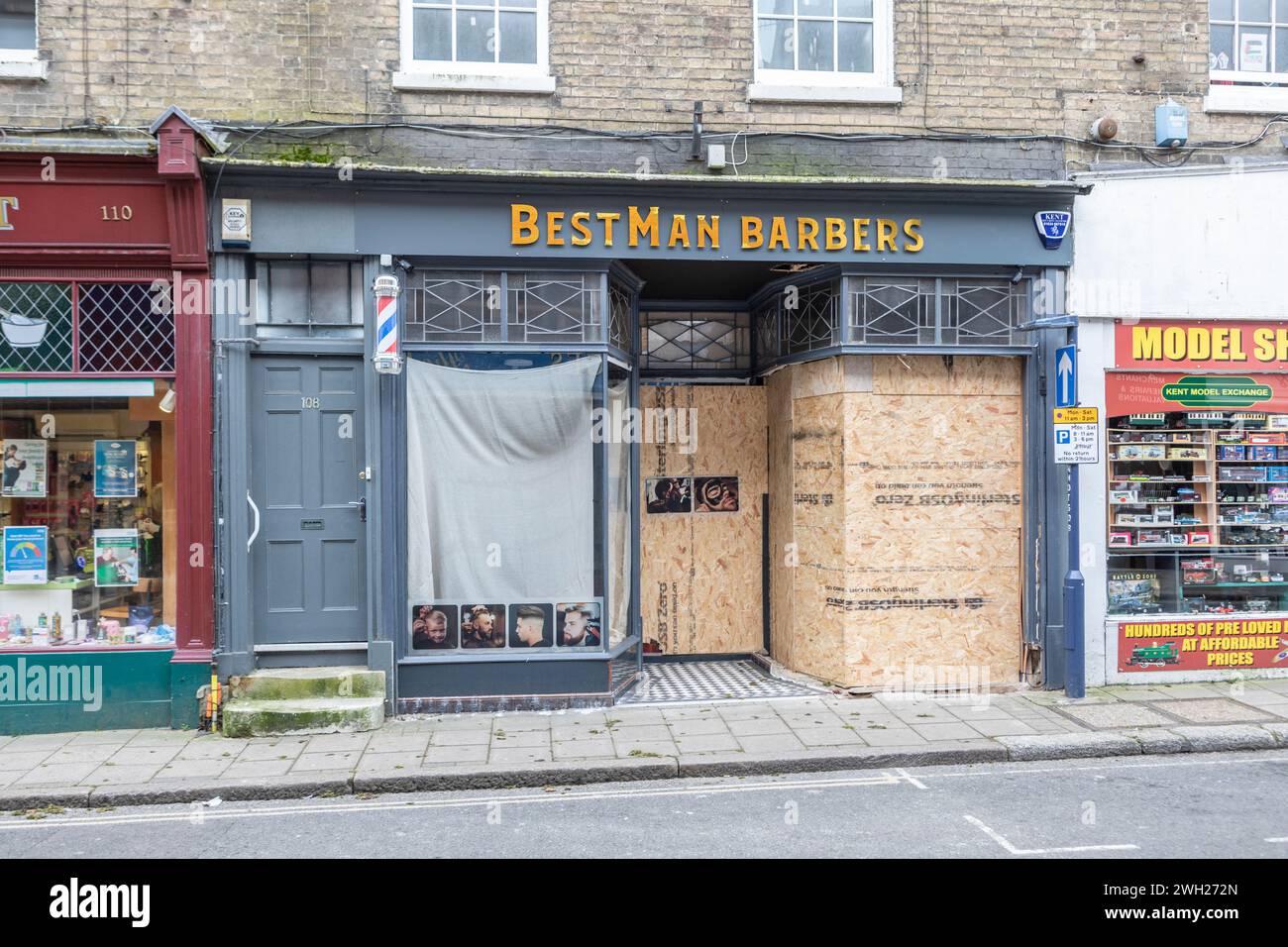 A barbers shop in Hythe High Street whose windows were smashed just prior to opening Stock Photo