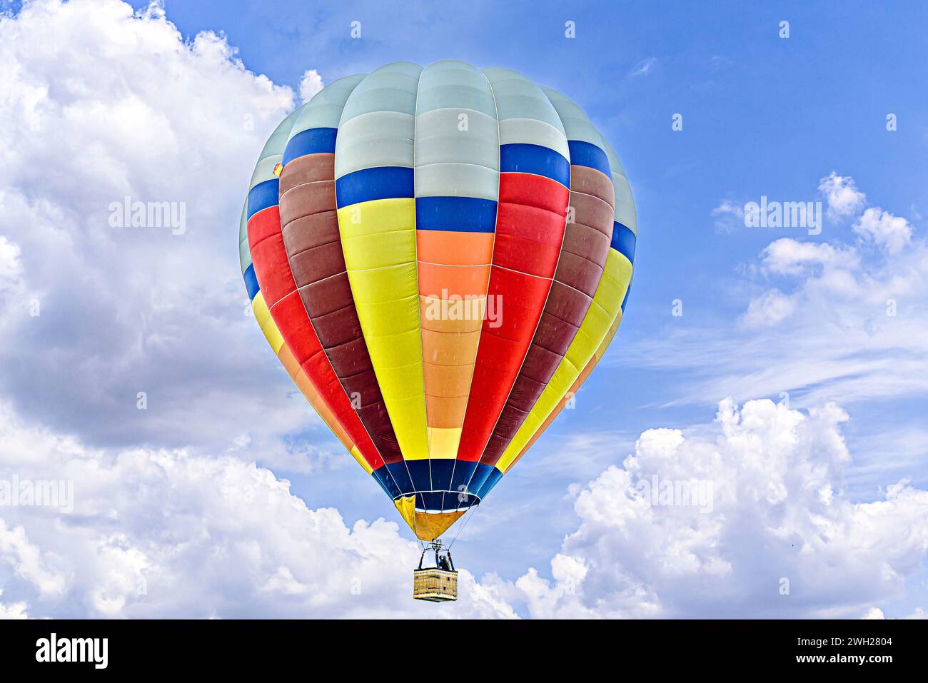 Colorful hot air balloon flying over blue sky with white cloud Stock ...